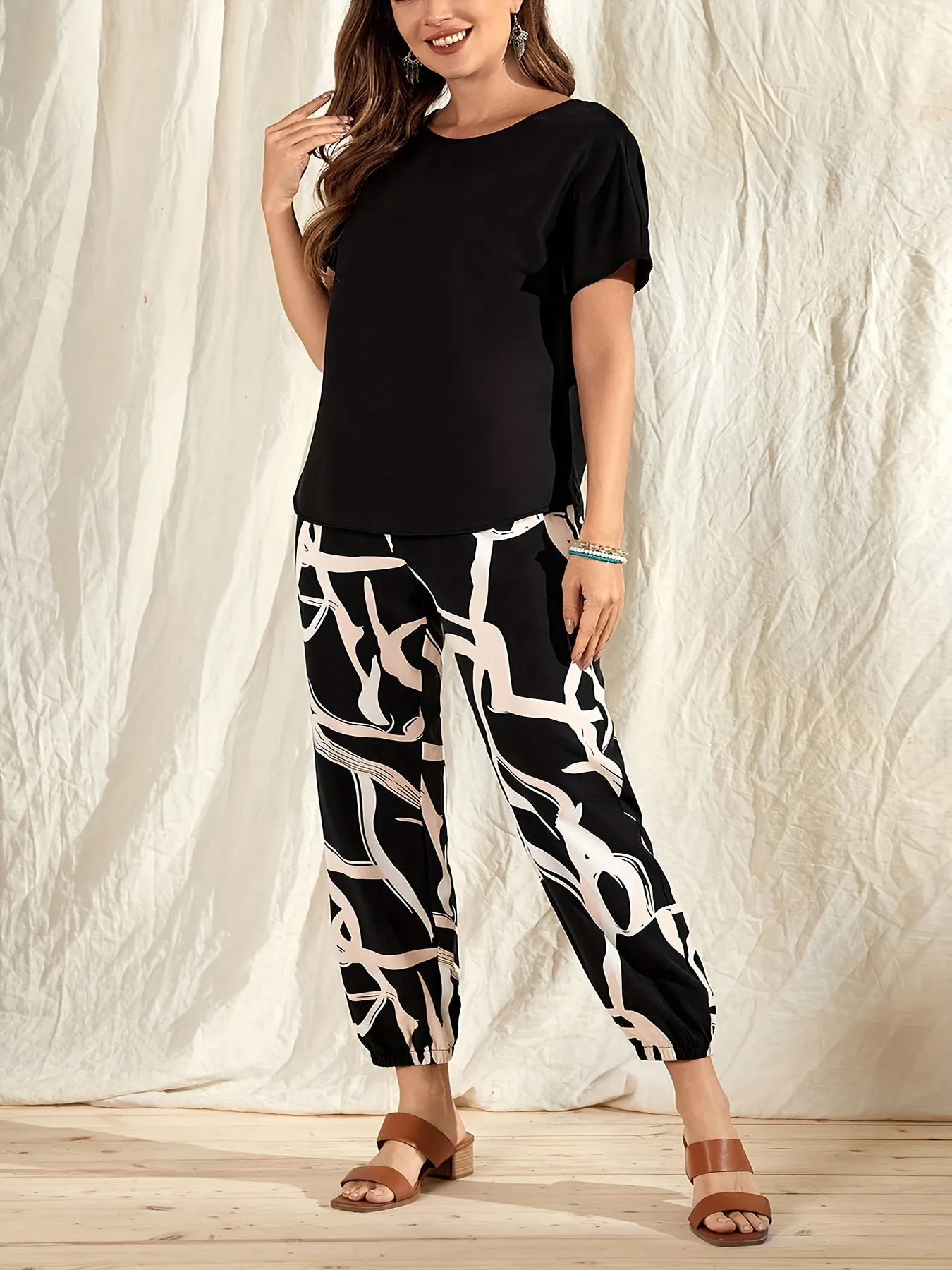 Plus Size Casual Duo - Crew Neck Short Sleeve Top & Colorblock Print Pants Set for Stylish Women